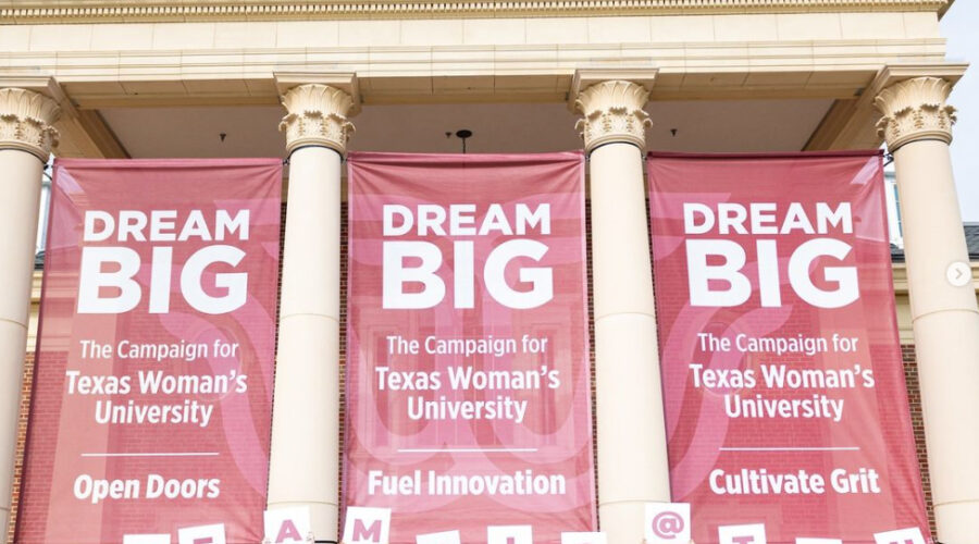TWU Dream Big campaign photo of students holding signs that spell out "Dream Big" in front of campus building.